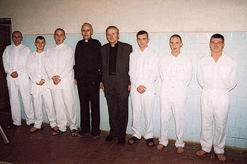Pastor Andrejs Arinsh and chaplain Rihards Krievinsh among baptism candidates in Jelgava prison