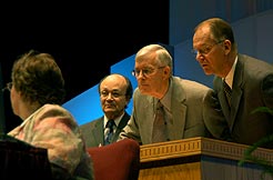 From left: Angel Rodriquez, director of the Biblical Research Institute; William Johnsson, editor of the Adventist Review; and Mike Ryan, director of Global Mission check the exact wording of the proposed protocols for revising the Adventist statements of fundamental beliefs, before answering a question from a delegate.