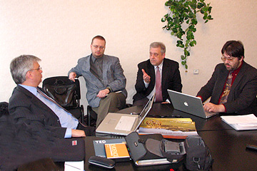 Leaders of the evangelism for postmoderns concept LIFEdevelopment (LD) discuss implementation strategy. Riga, Latvia. 2006.04.05